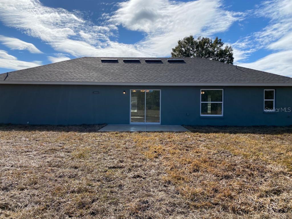 3331 Southwest 153rd Pl Road Ocala, FL 34473 - Photo 31 of 35 a house with a yard