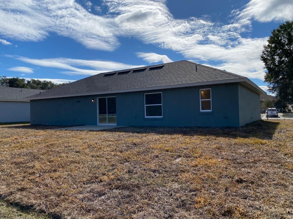 3331 Southwest 153rd Pl Road Ocala, FL 34473 - Photo 32 of 35 a backyard of a house