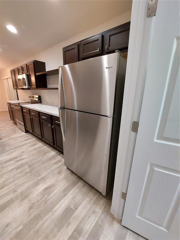 3331 Southwest 153rd Pl Road Ocala, FL 34473 - Photo 10 of 35 a white refrigerator freezer sitting inside of a kitchen
