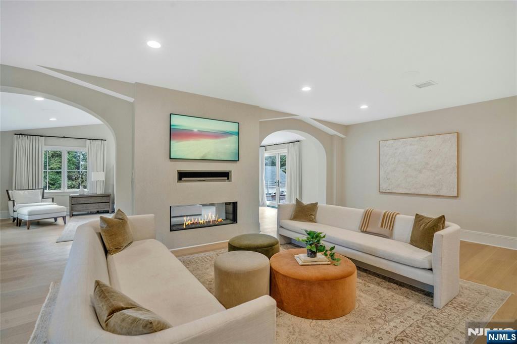 96 Bluff Road Fort Lee, NJ 07024 - Photo 12 of 22 a living room with furniture and a flat screen tv