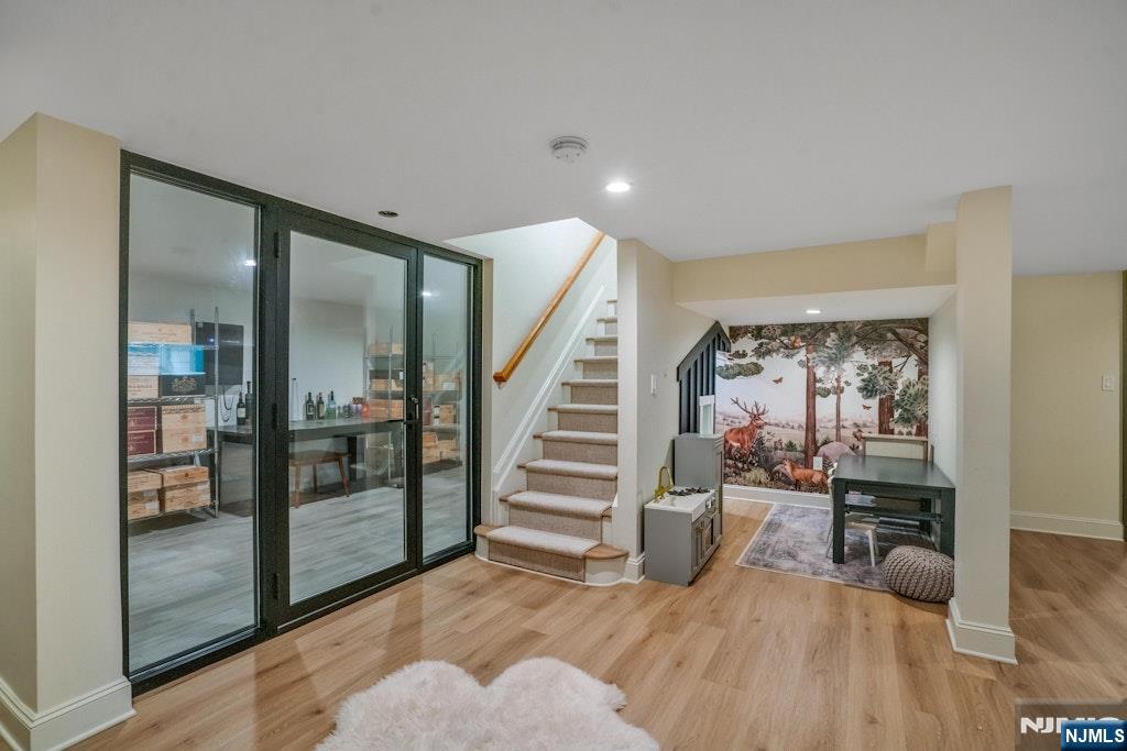 96 Bluff Road Fort Lee, NJ 07024 - Photo 19 of 22 a view of an entryway with wooden floor and a livingroom