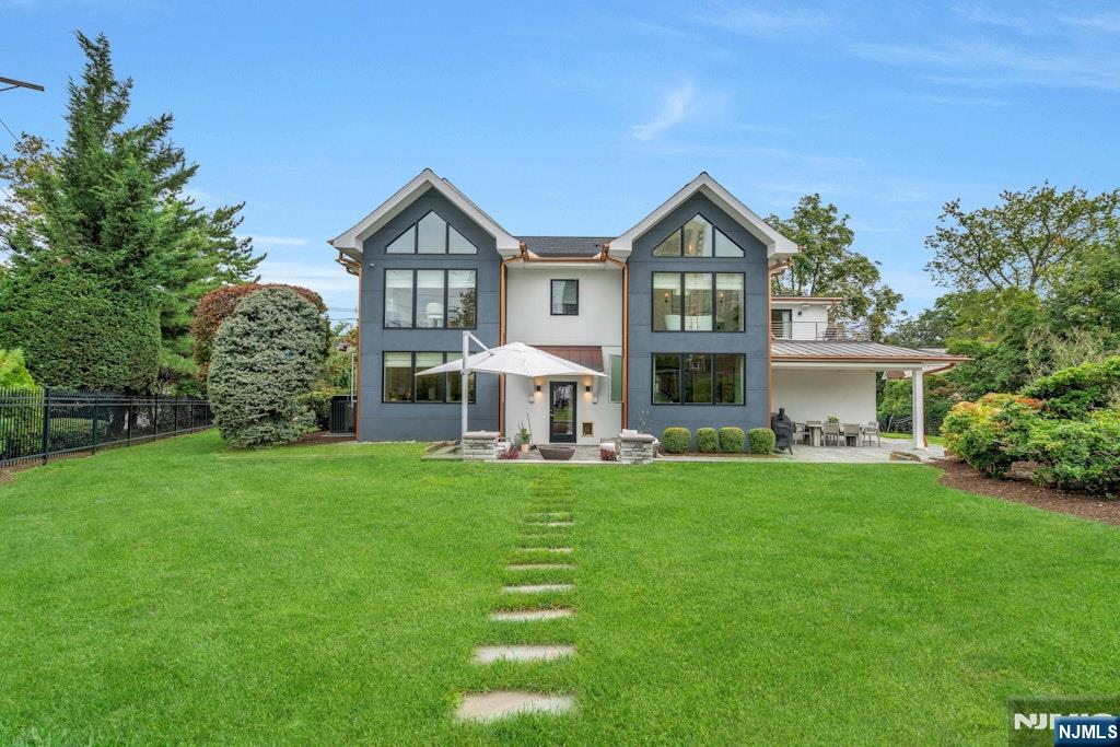 96 Bluff Road Fort Lee, NJ 07024 - Photo 21 of 22 a front view of a house with a garden and trees