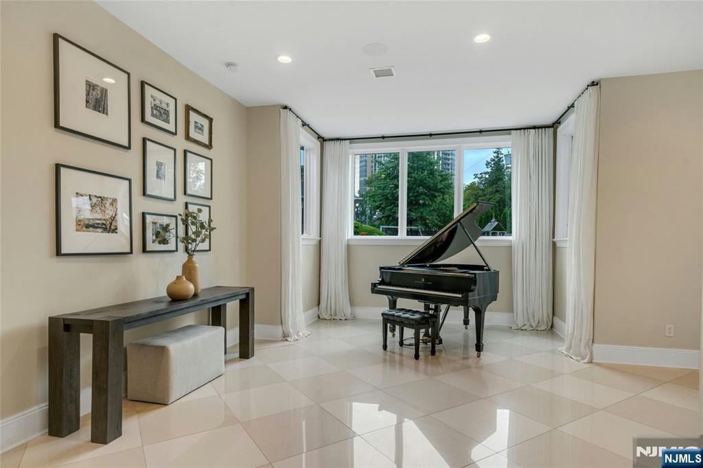 96 Bluff Road Fort Lee, NJ 07024 - Photo 5 of 22 a living room with furniture a piano and a window