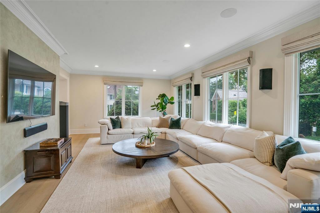 96 Bluff Road Fort Lee, NJ 07024 - Photo 9 of 22 a living room with furniture and a flat screen tv