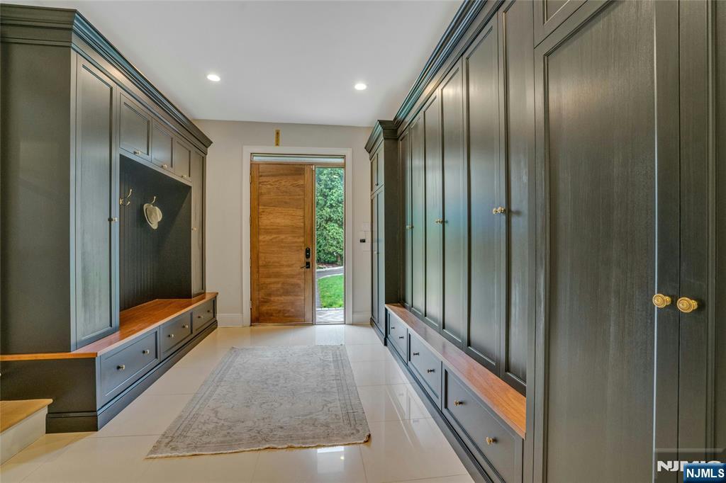 96 Bluff Road Fort Lee, NJ 07024 - Photo 10 of 22 a bathroom with a large mirror and a shower