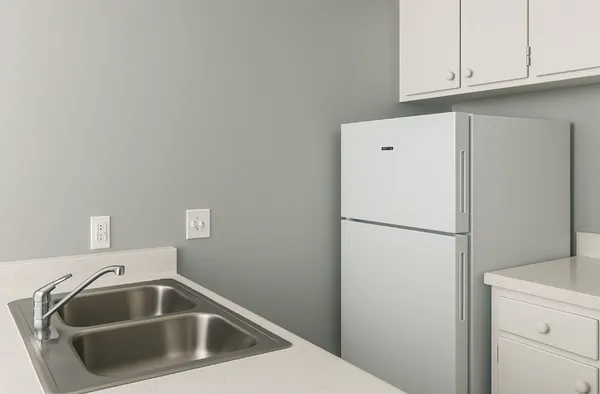 a white refrigerator freezer sitting inside of a kitchen