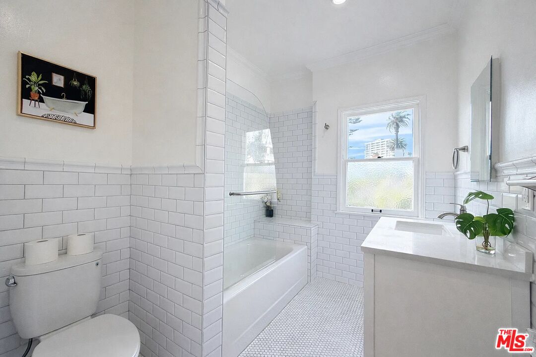 423 Ocean, Unit 2 Santa Monica, CA 90403 - Photo 16 of 18 a bathroom with a sink a toilet and shower