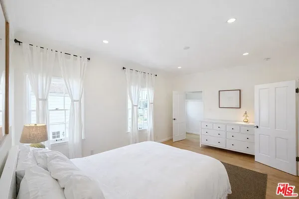 a bedroom with a bed and a cabinets