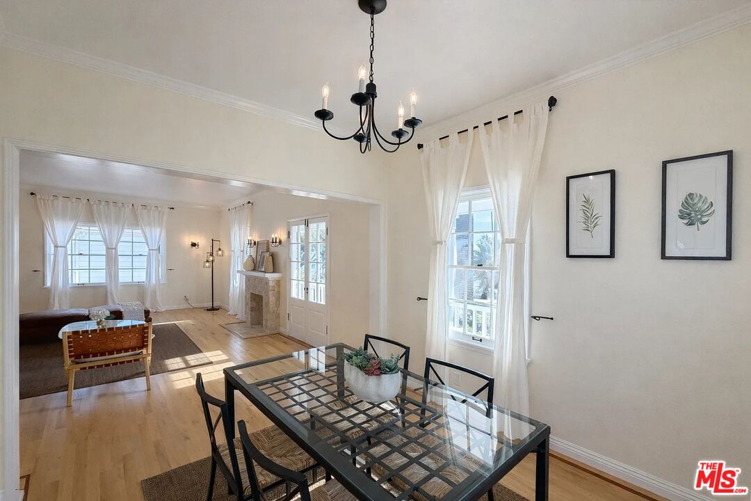 423 Ocean, Unit 2 Santa Monica, CA 90403 - Photo 10 of 18 a view of a livingroom and dining room with furniture wooden floor a chandelier