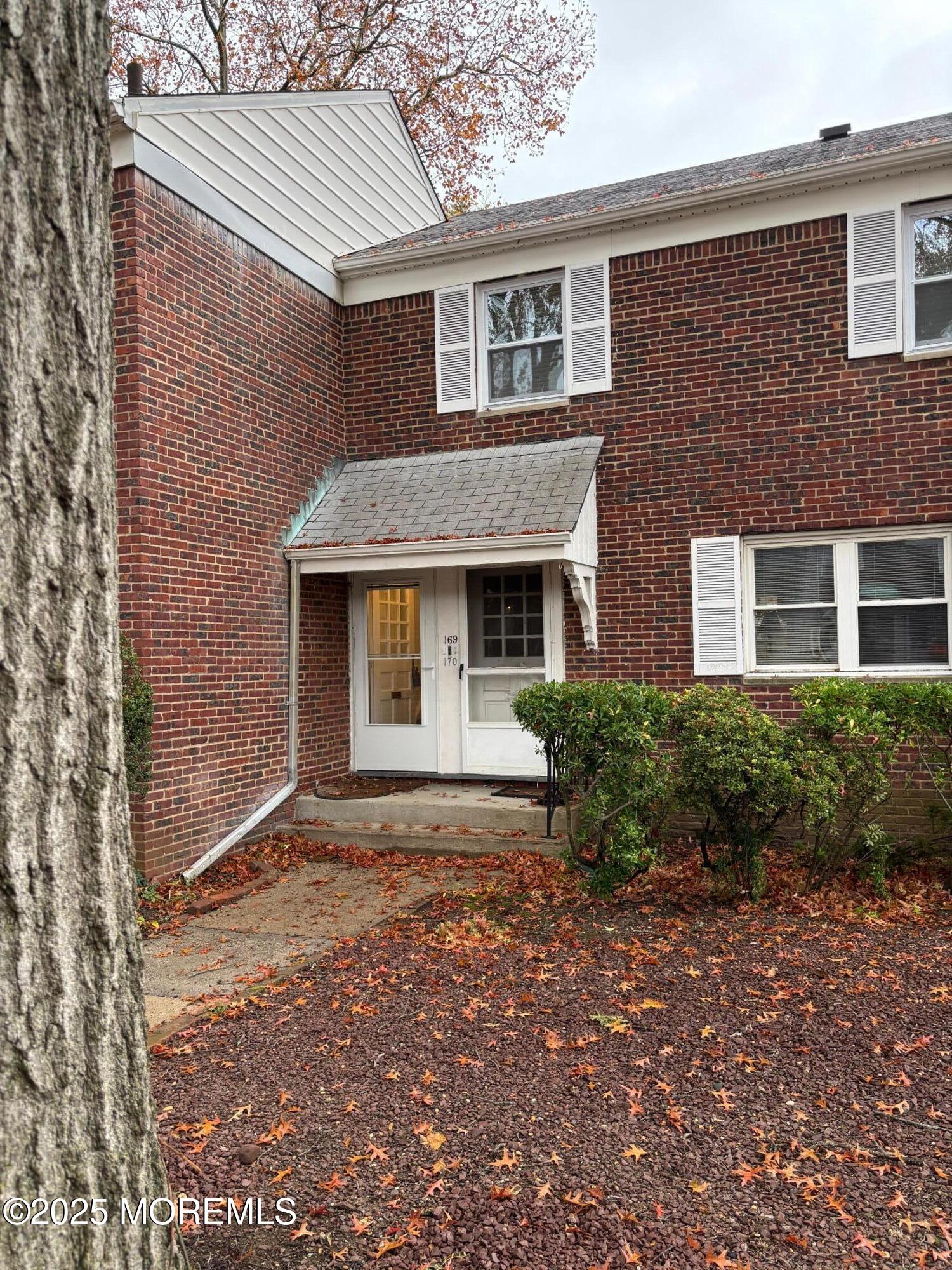 169 Manor Drive Red Bank, NJ 07701 - Photo 14 of 15 a front view of a house with a yard