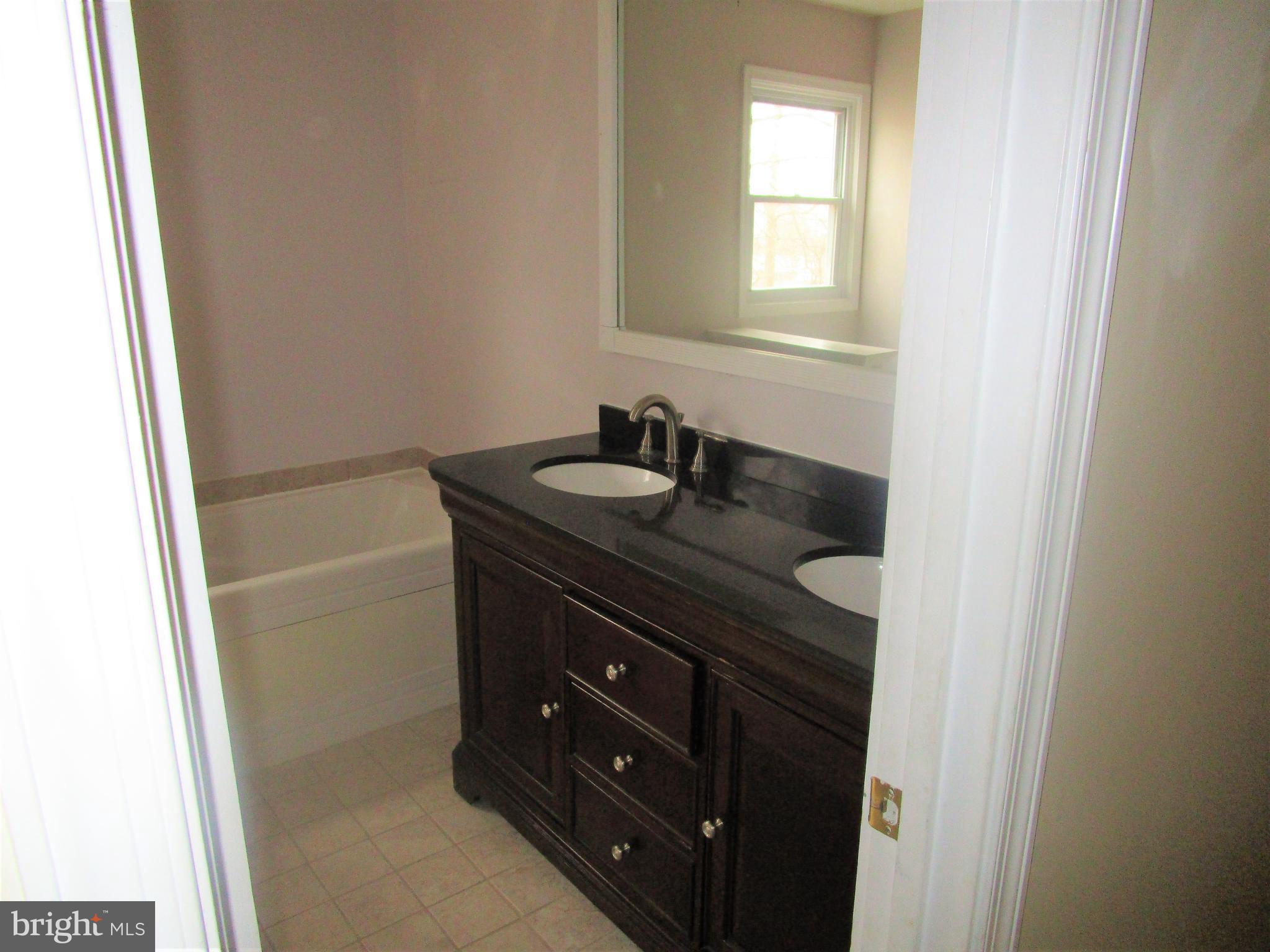 810 Ferguson Road Joppa, MD 21085 - Photo 14 of 22 Full bath with jetted tub and separate shower