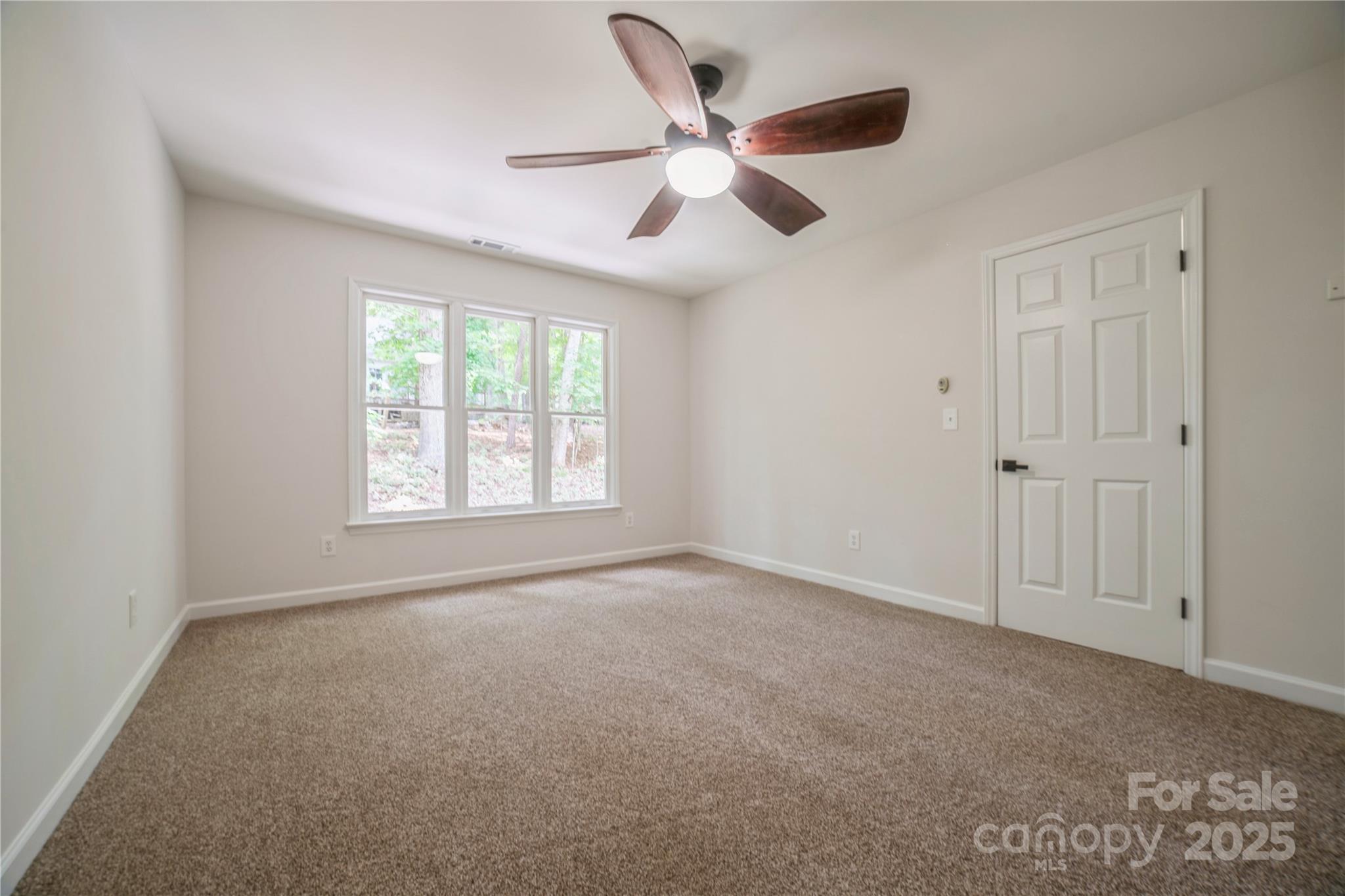 26056 Neptunes Landing Fort Mill, SC 29708 - Photo 25 of 47 a view of an empty room with a window
