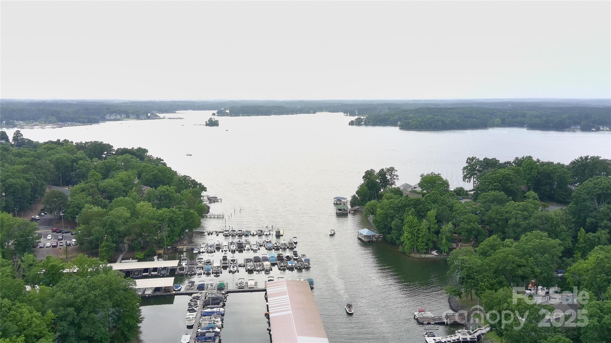 26056 Neptunes Landing Fort Mill, SC 29708 - Photo 43 of 47 a view of a lake with houses in the back