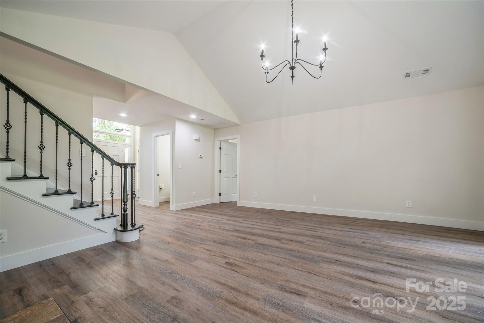 26056 Neptunes Landing Fort Mill, SC 29708 - Photo 6 of 47 a view of an empty room with wooden floor