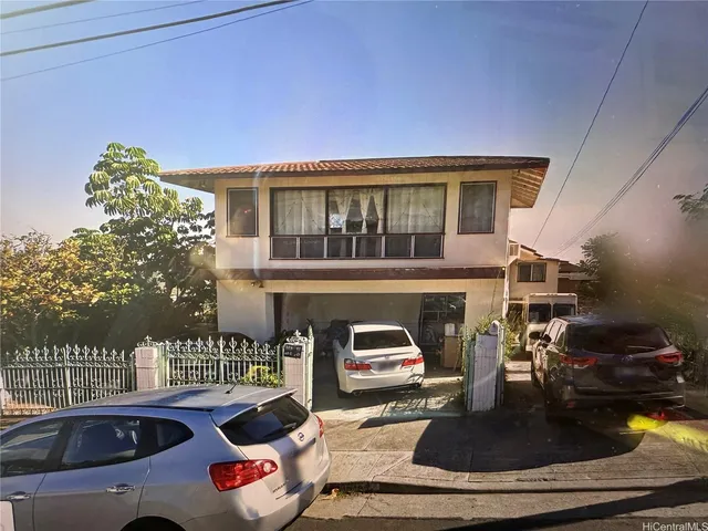 a front view of a house with outdoor seating