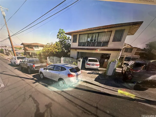 a view of a street with cars