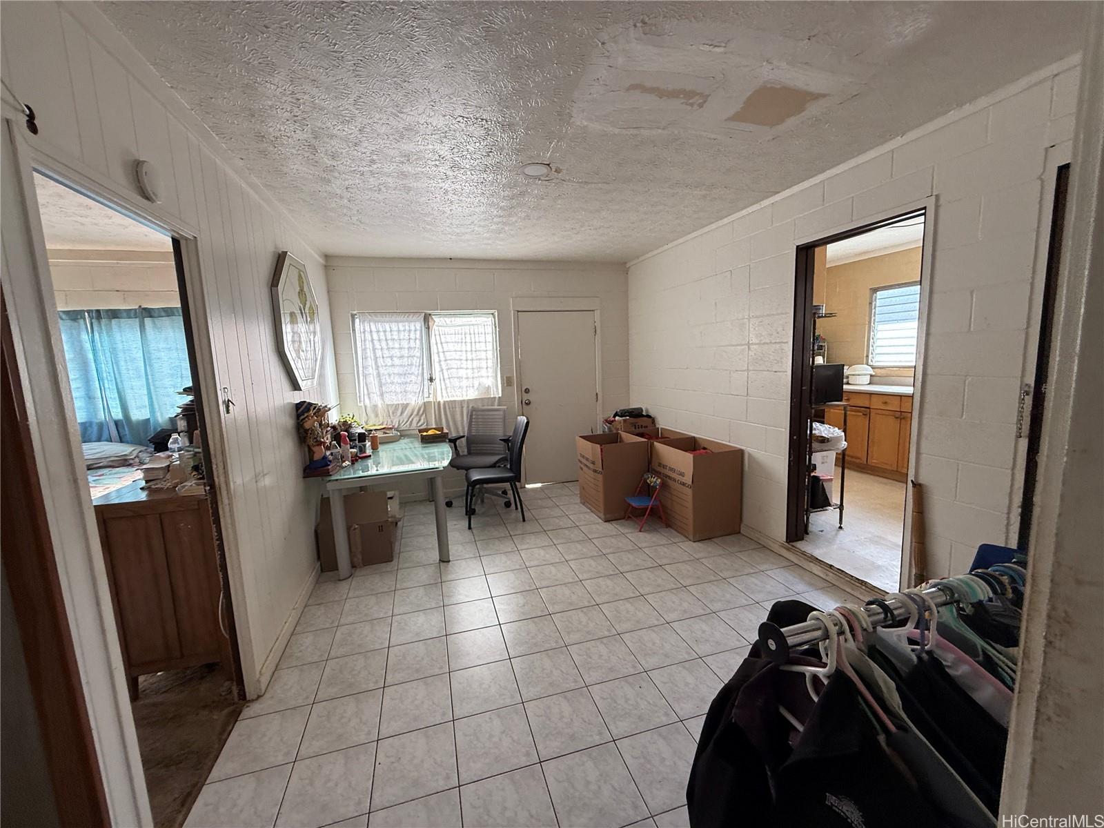 3647 Likini Street Honolulu, HI 96818 - Photo 7 of 8 a view of a room with gym equipment