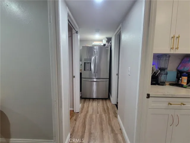 a view of a kitchen from the hallway