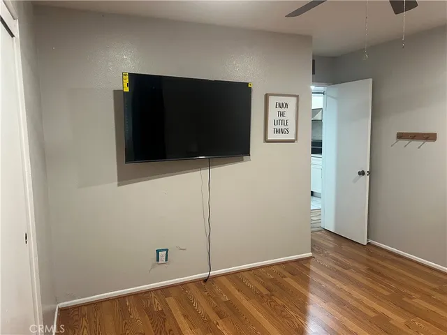 a view of a livingroom with wooden floor
