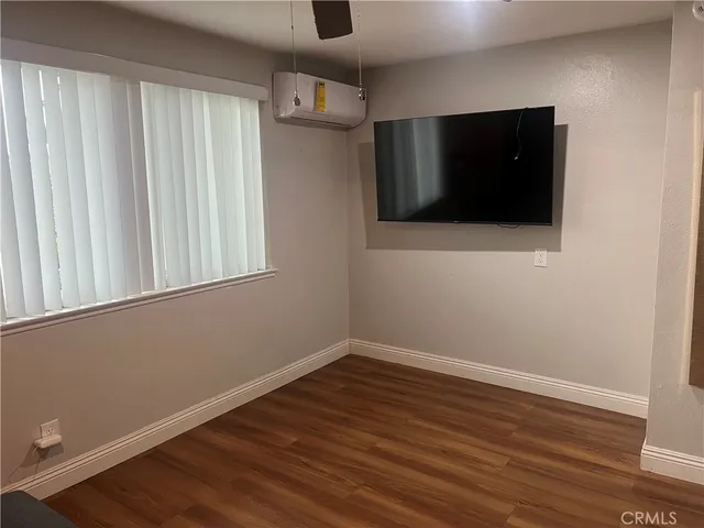 a view of a livingroom with wooden floor