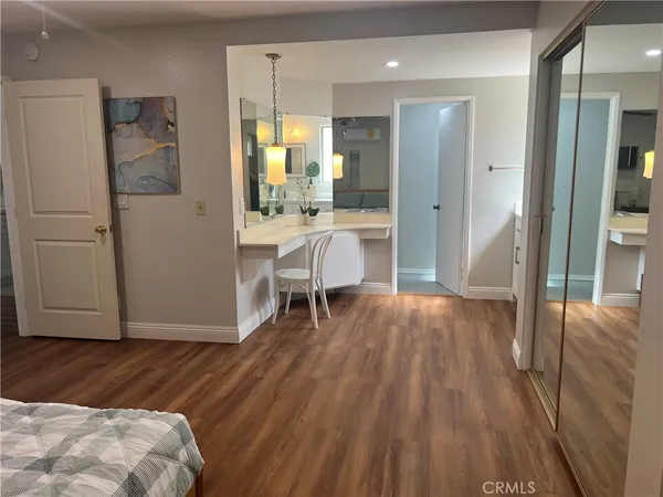 a view of kitchen with furniture and wooden floor