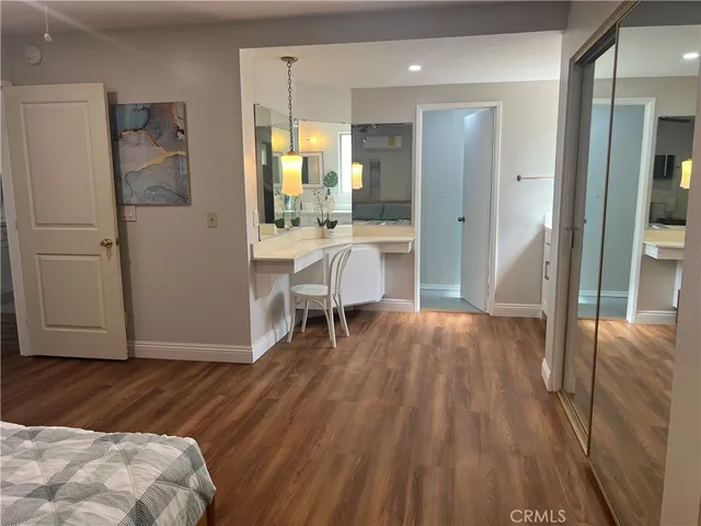 a view of kitchen with furniture and wooden floor