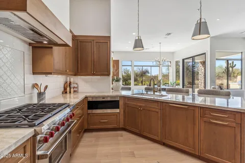 a kitchen with a stove and a sink