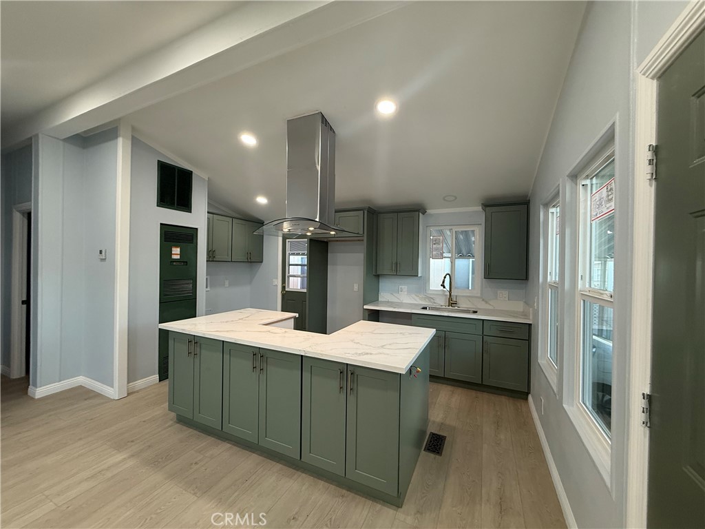 716 North Grand, Unit D3 Covina, CA 91724 - Photo 14 of 35 a large kitchen with a sink and refrigerator