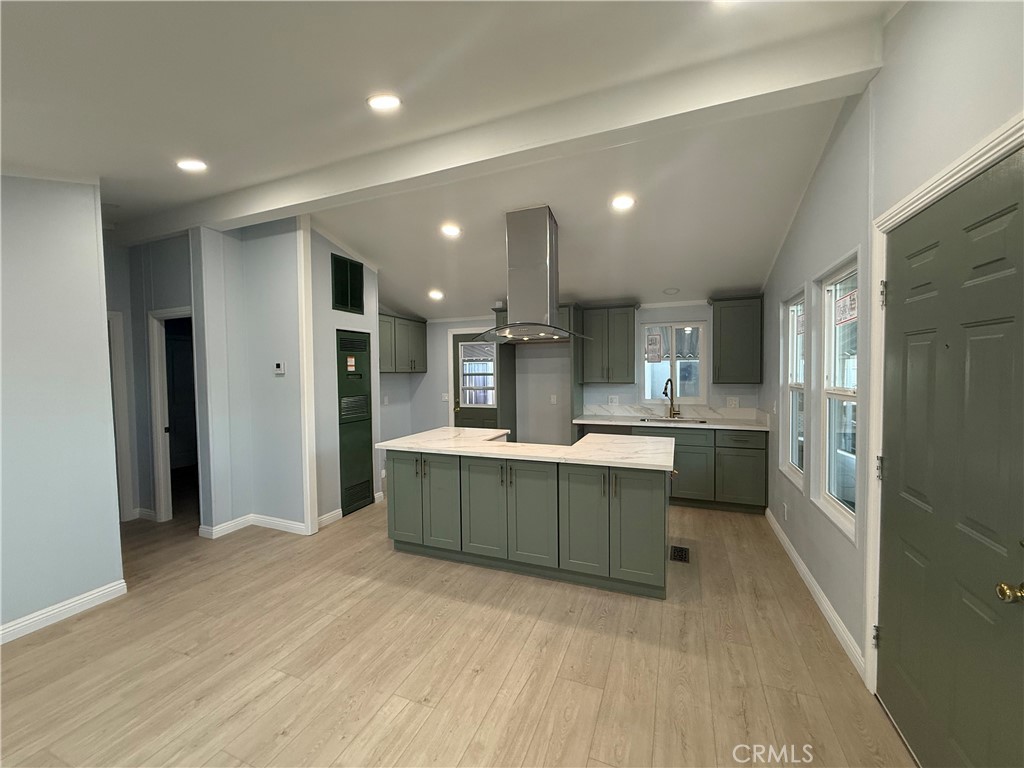 716 North Grand, Unit D3 Covina, CA 91724 - Photo 15 of 35 a large kitchen with a lot of counter space and a refrigerator