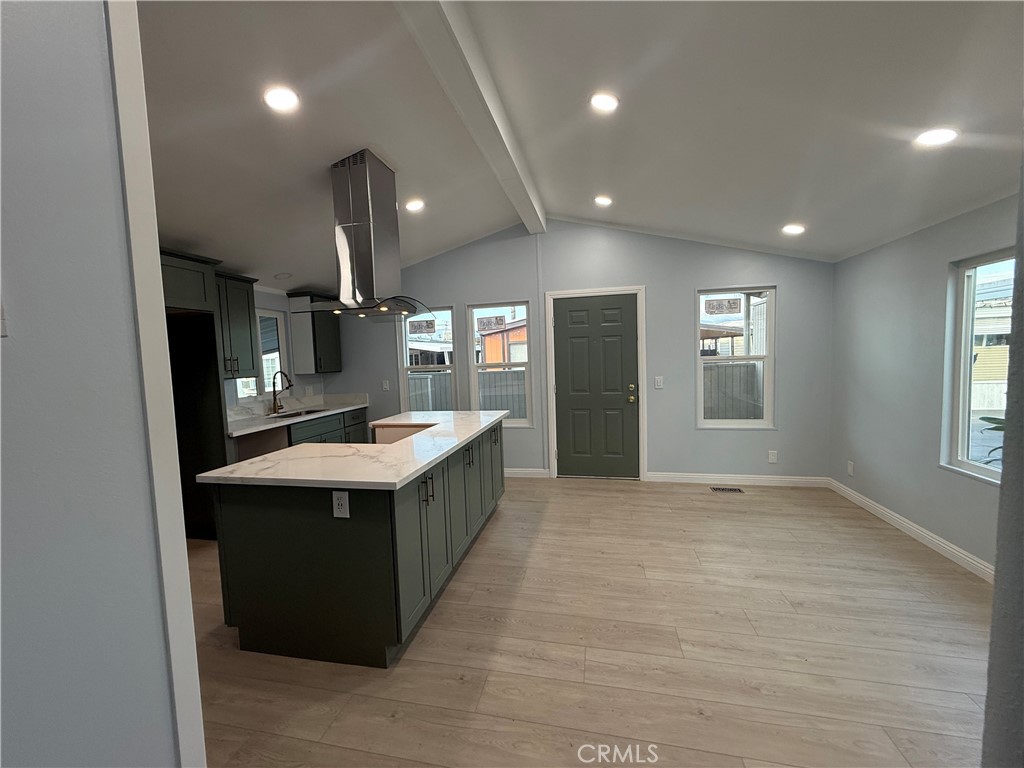 716 North Grand, Unit D3 Covina, CA 91724 - Photo 16 of 35 a large white kitchen with a sink and dishwasher