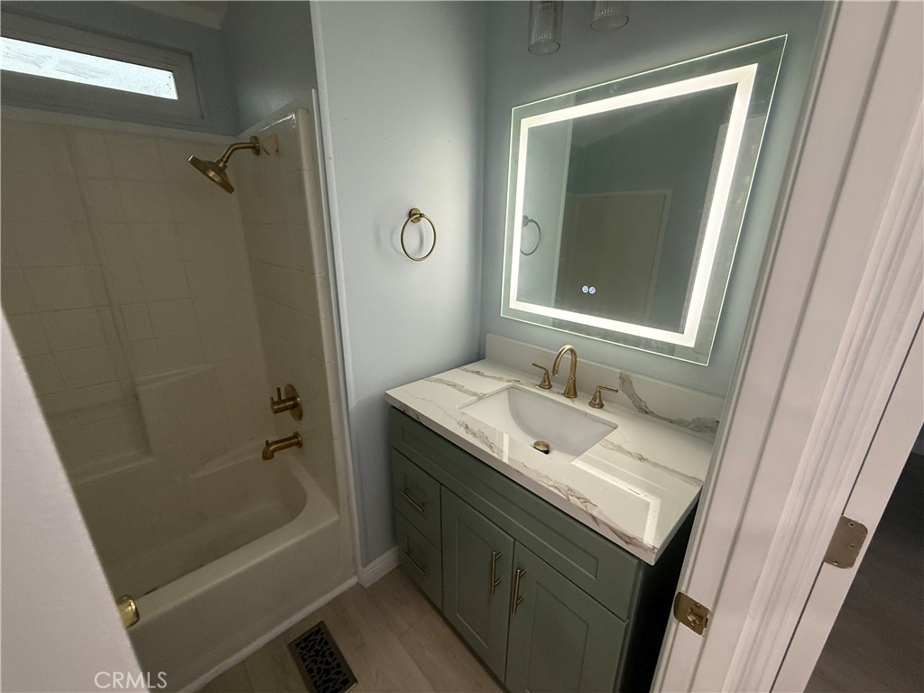 716 North Grand, Unit D3 Covina, CA 91724 - Photo 23 of 35 a bathroom with a granite countertop sink toilet and shower
