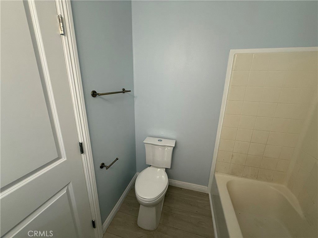 716 North Grand, Unit D3 Covina, CA 91724 - Photo 25 of 35 a white toilet sitting in a bathroom next to a sink
