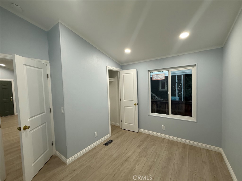 716 North Grand, Unit D3 Covina, CA 91724 - Photo 29 of 35 an empty room with windows and closet