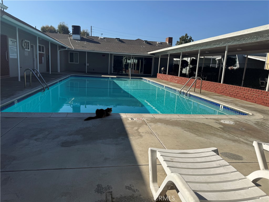716 North Grand, Unit D3 Covina, CA 91724 - Photo 4 of 35 a view of a house with pool and sitting area