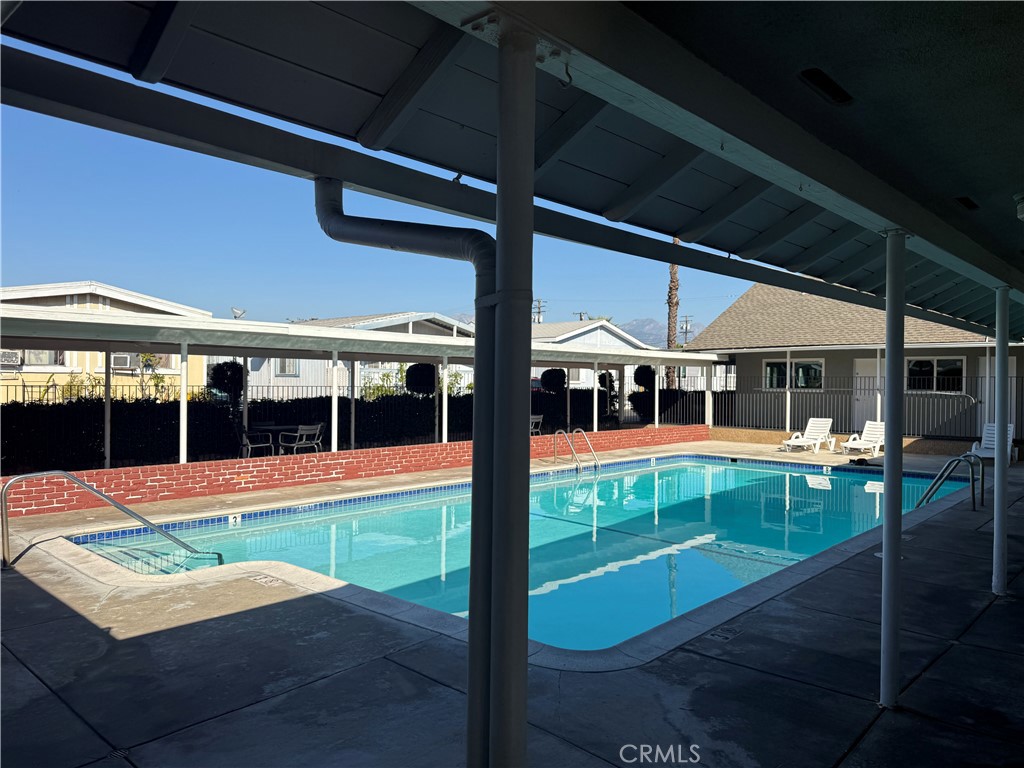 716 North Grand, Unit D3 Covina, CA 91724 - Photo 5 of 35 a view of swimming pool with chairs in patio