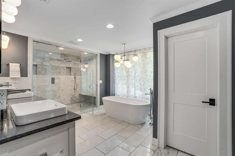 1678 Nottingham Way Northeast Atlanta, GA 30309 - Photo 19 of 57 a spacious bathroom with a shower and a bathtub