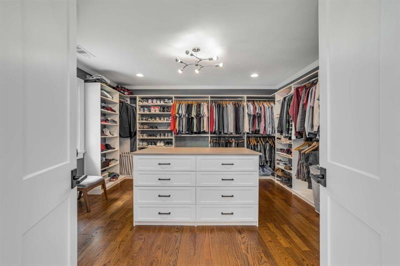 1678 Nottingham Way Northeast Atlanta, GA 30309 - Photo 20 of 57 a view of walk in closet with clothes