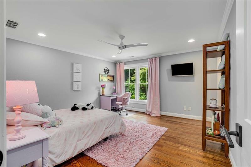1678 Nottingham Way Northeast Atlanta, GA 30309 - Photo 21 of 57 a bed room with a bed and a window