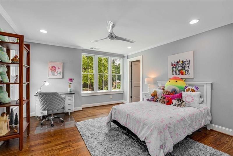 1678 Nottingham Way Northeast Atlanta, GA 30309 - Photo 23 of 57 a bedroom with a bed and wooden floor