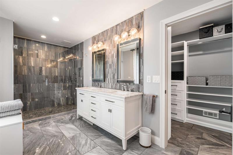 1678 Nottingham Way Northeast Atlanta, GA 30309 - Photo 26 of 57 a bathroom with a double vanity sink toilet and shower