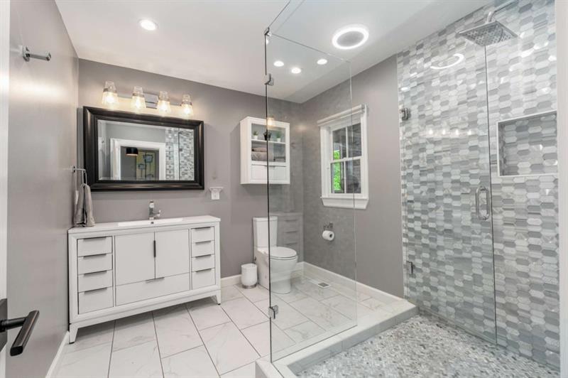 1678 Nottingham Way Northeast Atlanta, GA 30309 - Photo 28 of 57 a bathroom with a double vanity sink mirror and bathtub