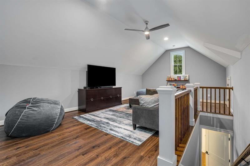 1678 Nottingham Way Northeast Atlanta, GA 30309 - Photo 30 of 57 a bedroom with furniture and a flat screen tv