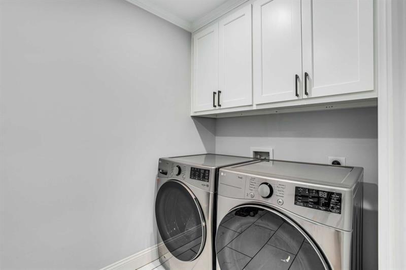 1678 Nottingham Way Northeast Atlanta, GA 30309 - Photo 34 of 57 a utility room with dryer and washer