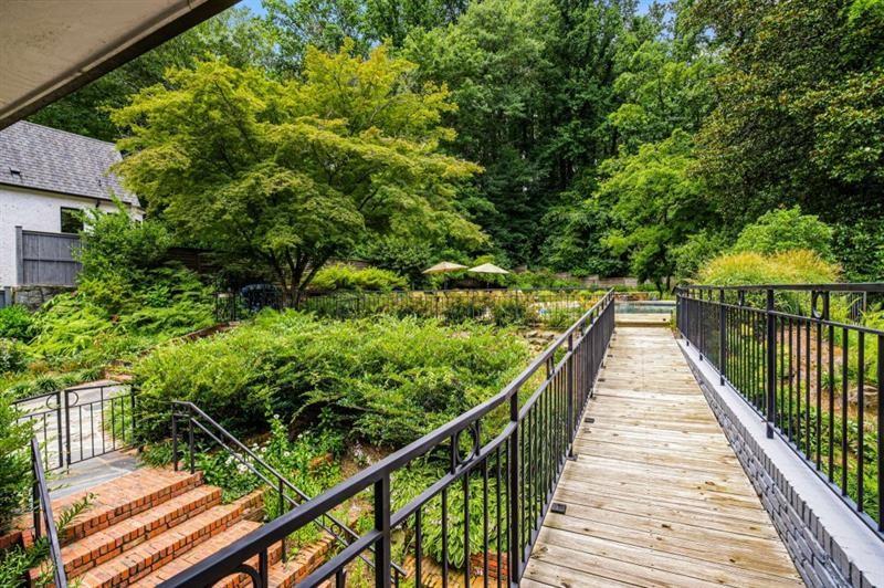 1678 Nottingham Way Northeast Atlanta, GA 30309 - Photo 46 of 57 a view of balcony with wooden floor and fence