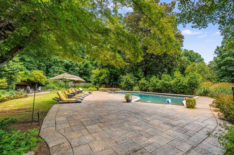 1678 Nottingham Way Northeast Atlanta, GA 30309 - Photo 48 of 57 a view of a swimming pool with a patio and a yard