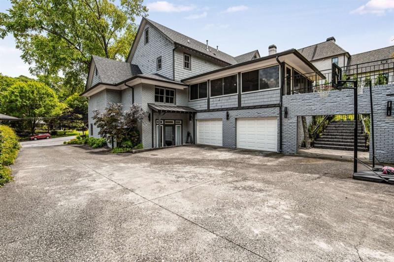 1678 Nottingham Way Northeast Atlanta, GA 30309 - Photo 55 of 57 a front view of a house with a yard