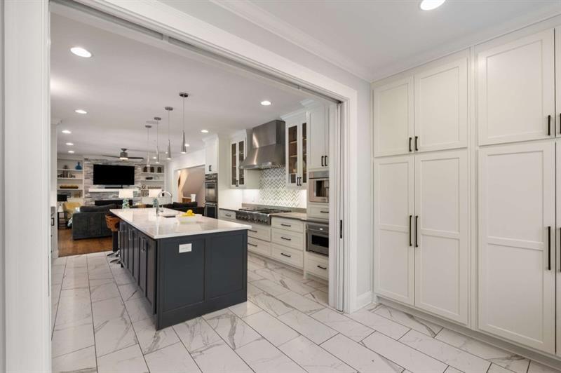 1678 Nottingham Way Northeast Atlanta, GA 30309 - Photo 8 of 57 a kitchen with cabinets and stainless steel appliances