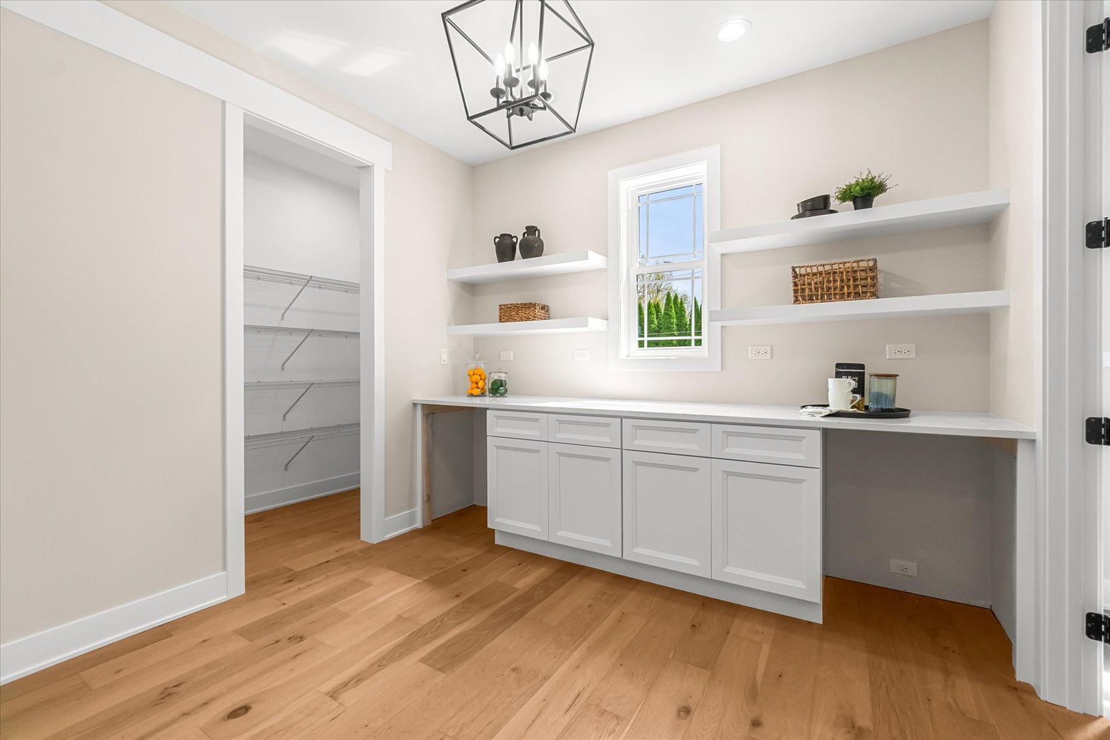 520 North Sleight Street Naperville, IL 60563 - Photo 12 of 51 a hallway with cabinets and wooden floor