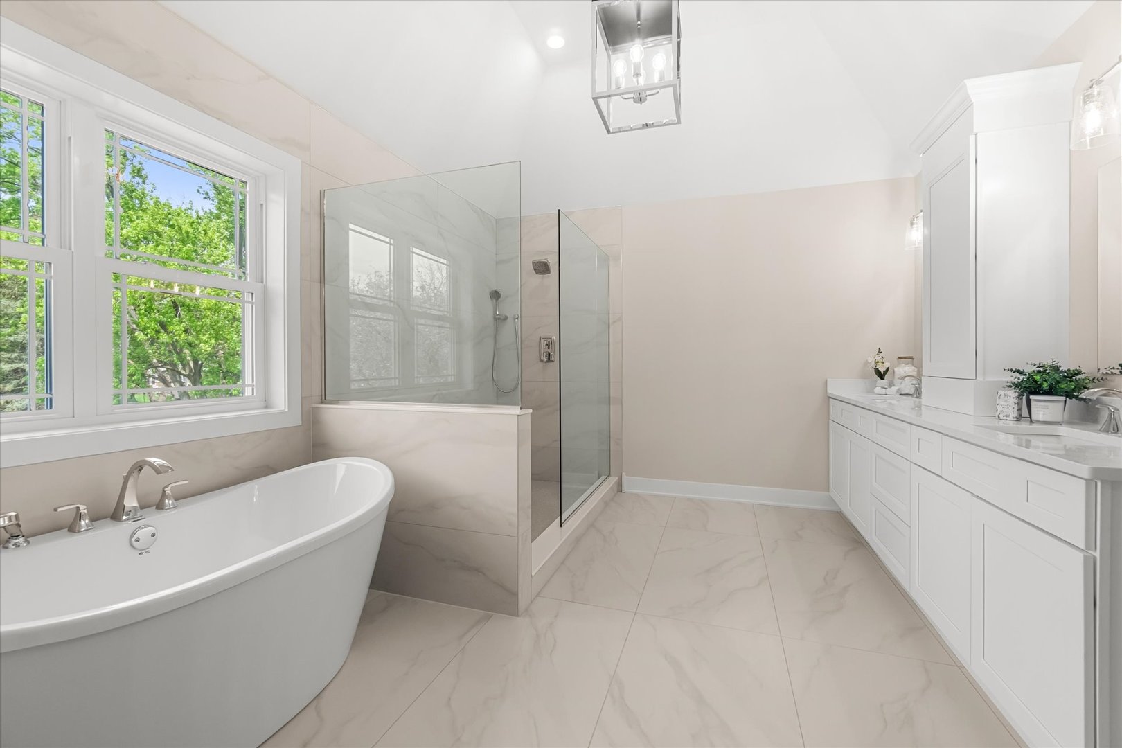 520 North Sleight Street Naperville, IL 60563 - Photo 26 of 51 a bathroom with a bathtub a sink a window and a shower