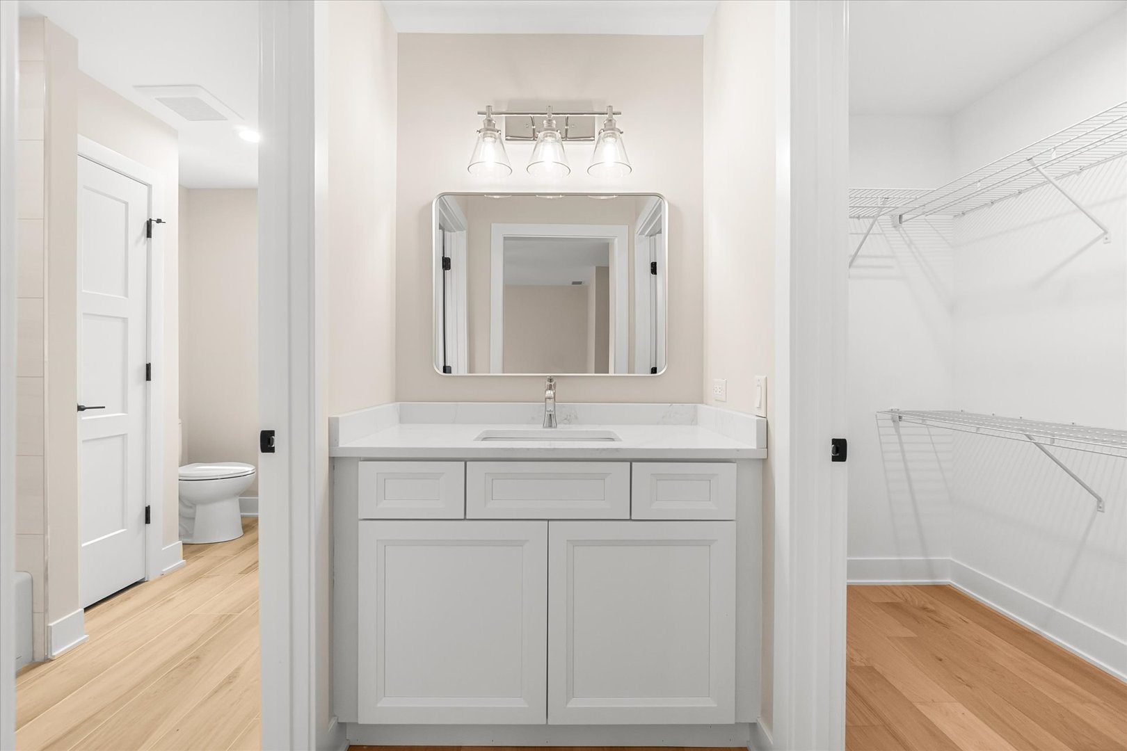 520 North Sleight Street Naperville, IL 60563 - Photo 32 of 51 a bathroom with a sink a toilet and a mirror